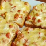 Toastbrot mit Schinken und Käse überbacken Rezept